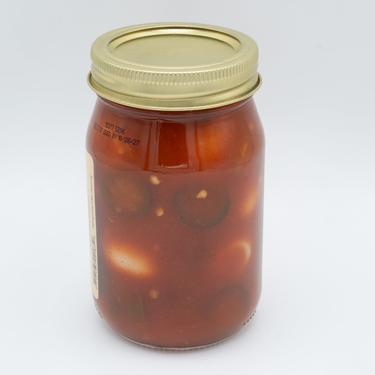 Canned Pickled Sriracha Quail Eggs from Amish Country Store in a jar with vibrant red Sriracha sauce and small quail eggs inside.