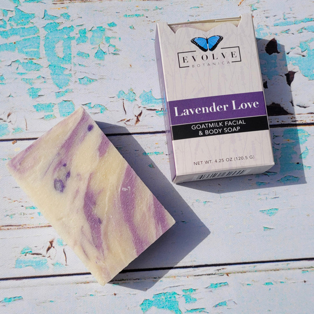 Bar of Evolve Botanica Lavender Love goat milk soap with lavender scent and creamy texture, displayed on a neutral background.