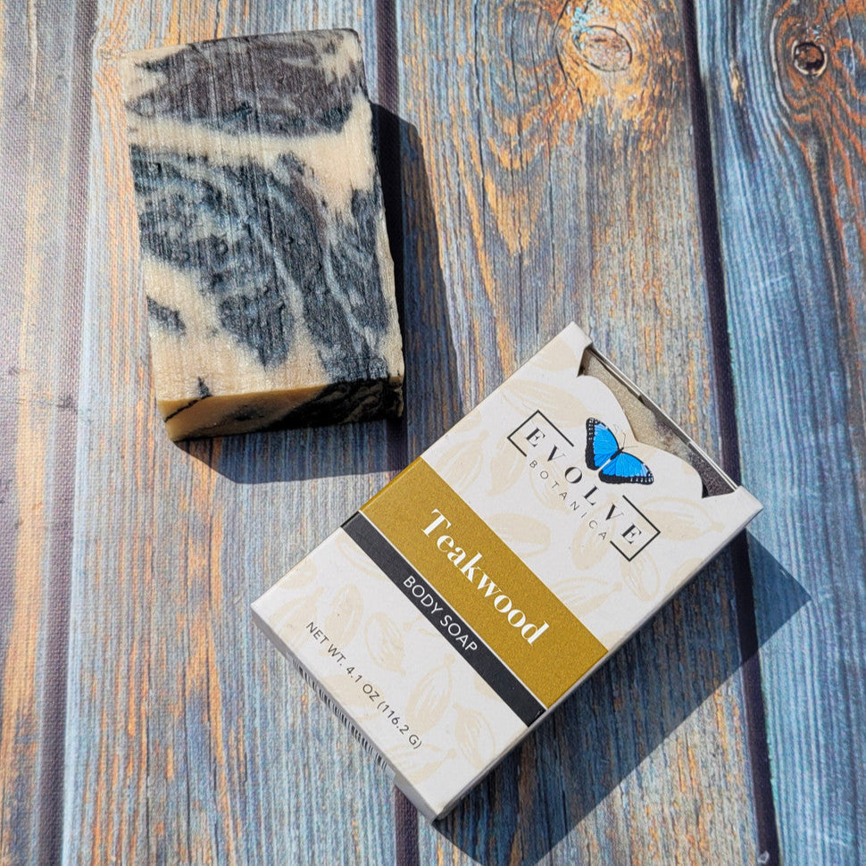 Evolve Botanica standard soap with teakwood scent, featuring a rectangular bar with a smooth, natural wooden texture and beige color.