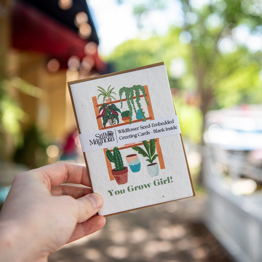 Still Magnolia You Grow Girl plantable seed card featuring floral illustrations and biodegradable paper for planting.