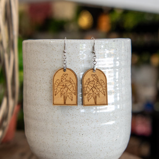Still Magnolia Alocasia Arched Earrings featuring elegant, leaf-shaped design in silver with intricate detailing.