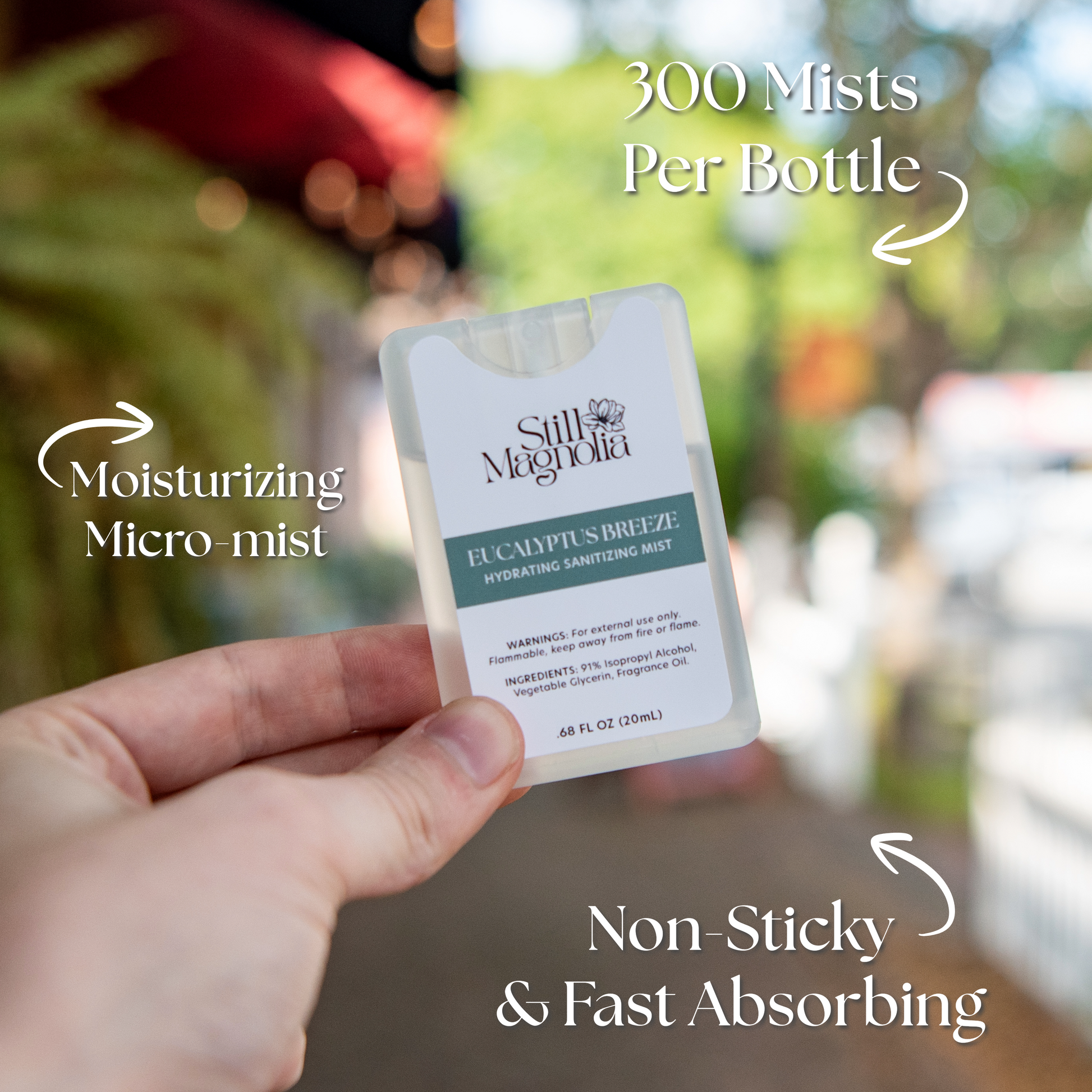 Still Magnolia Eucalyptus Breeze Hydrating Sanitizing Mist bottle with eucalyptus leaves, showcasing the refreshing, hydrating spray.