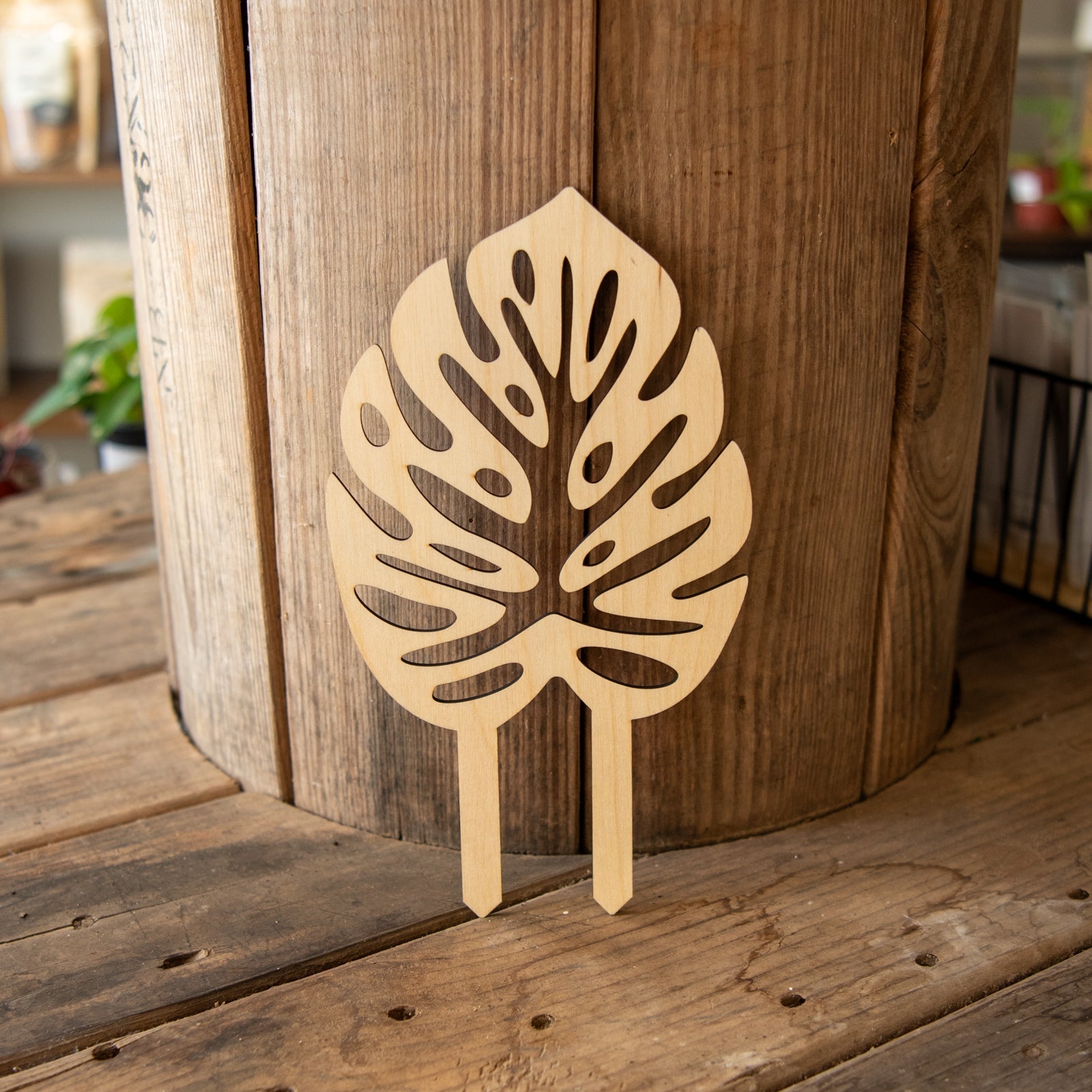 Still Magnolia plant trellis featuring a decorative monstera leaf design, perfect for supporting climbing plants indoors or outdoors.