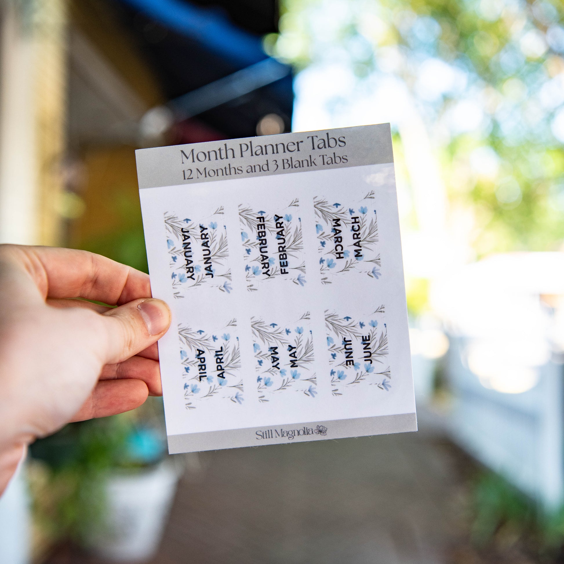 Still Magnolia Wildflower Whisper Planner Tabs sticker sheet with floral designs for organizing planners.