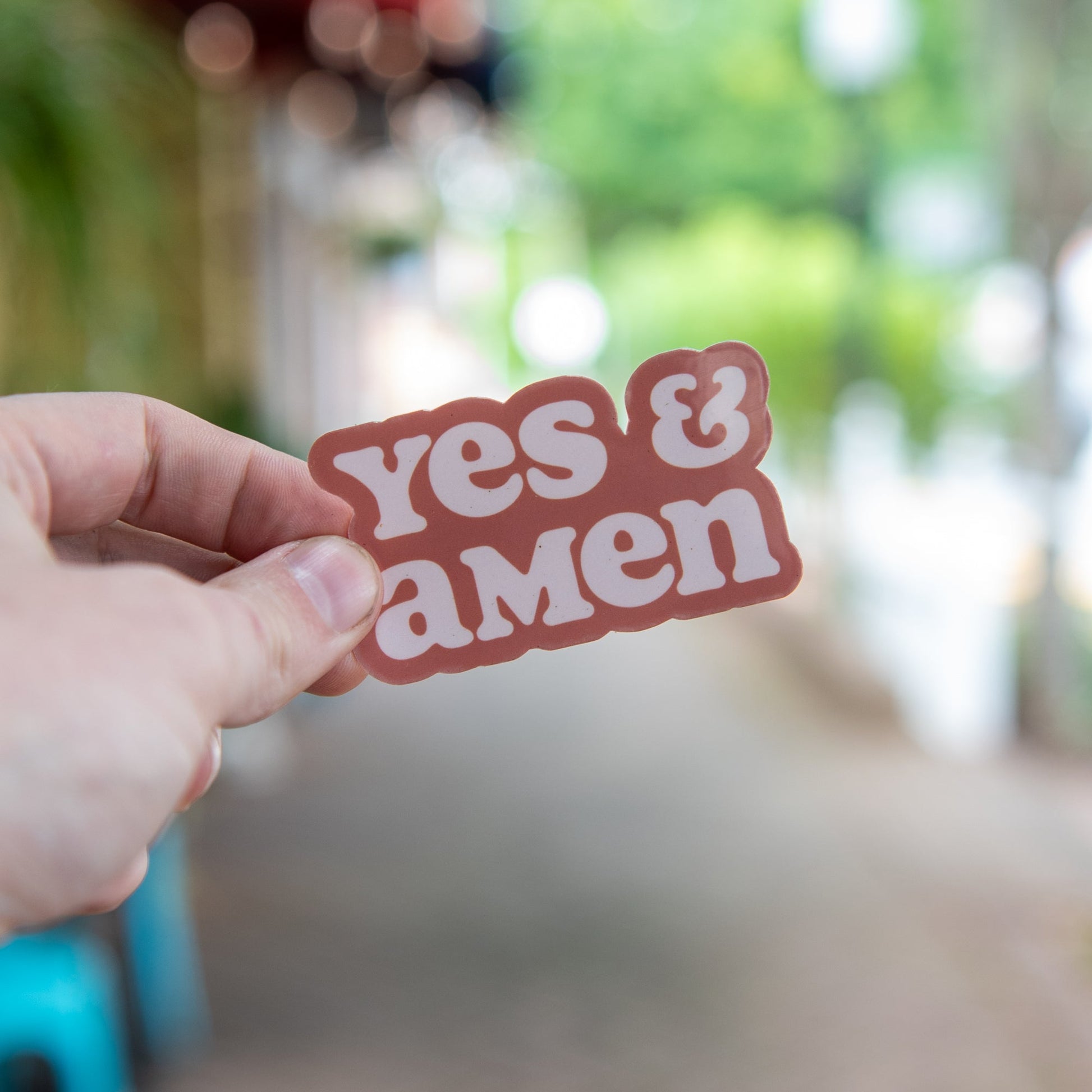 Still Magnolia Yes & Amen sticker featuring bold text on a colorful background, perfect for decorating notebooks or laptops.