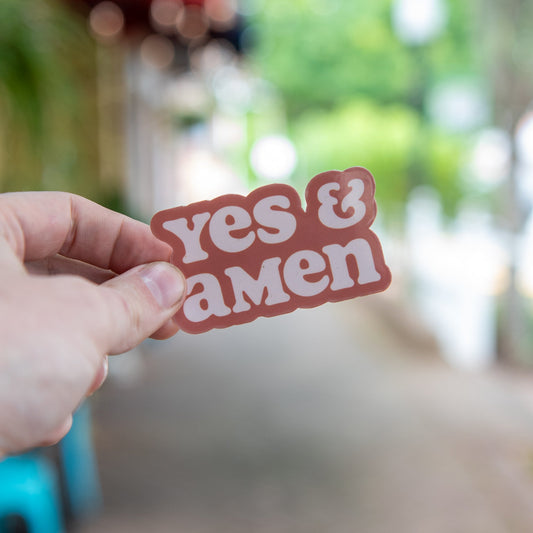 Still Magnolia Yes & Amen sticker featuring bold text on a colorful background, perfect for decorating notebooks or laptops.