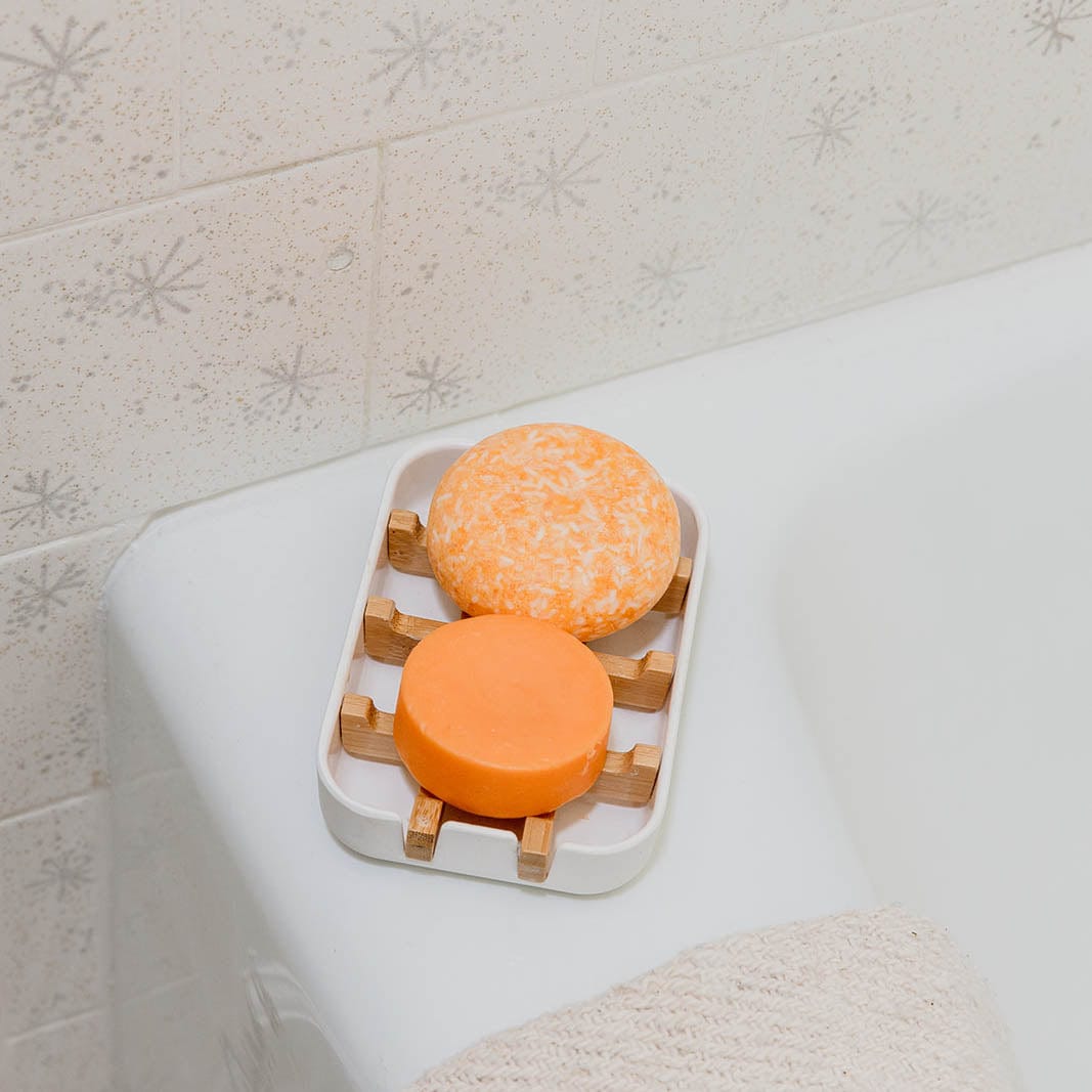 ZeroWasteStore.com shampoo and conditioner bar duo with suds, available in 12 scents, vegan and SLS-free, best-seller set.