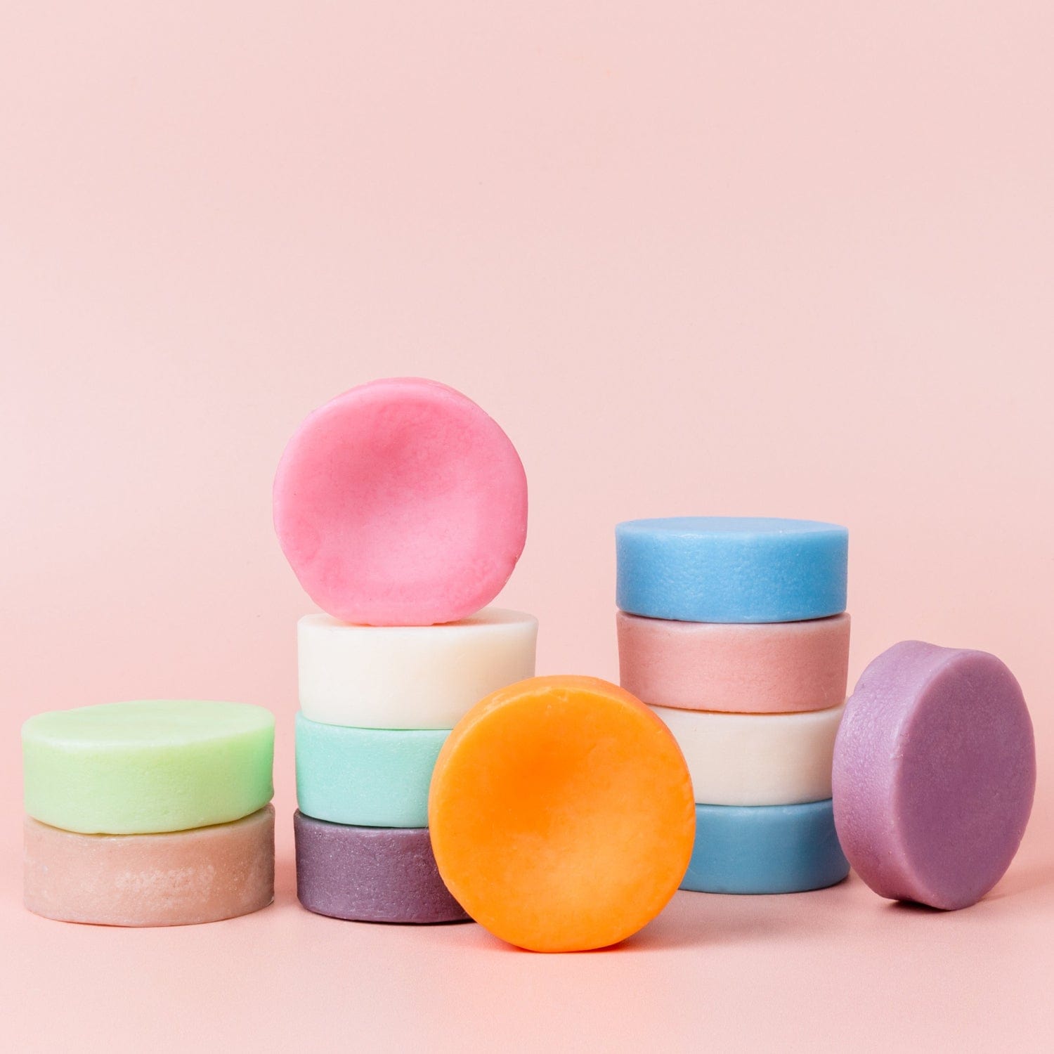 Eco-friendly conditioner bar with suds from ZeroWasteStore.com, showcasing a natural, solid hair conditioner in a reusable container.