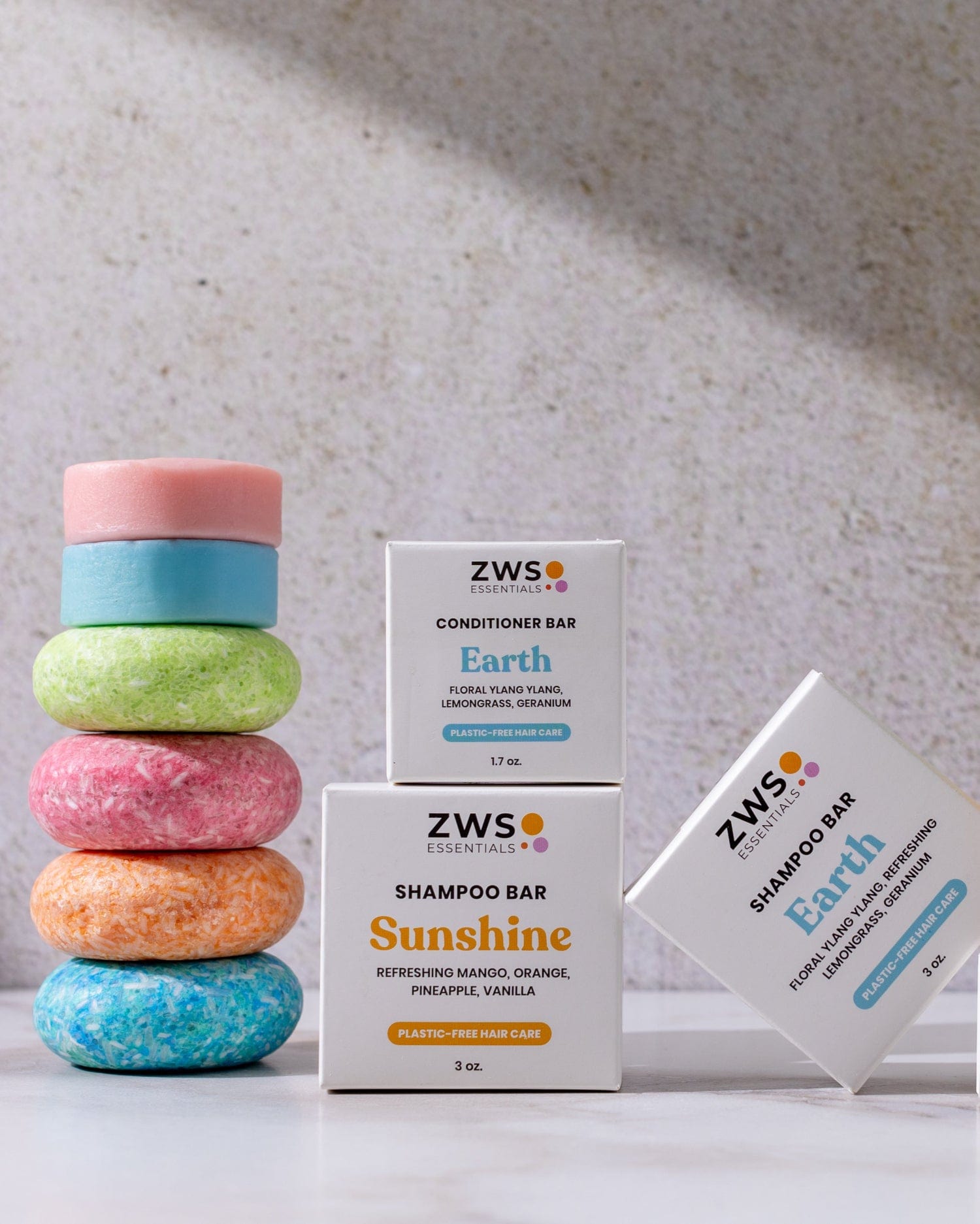 Eco-friendly shampoo and conditioner bar duo from ZeroWasteStore.com, with soap suds and product packaging visible.