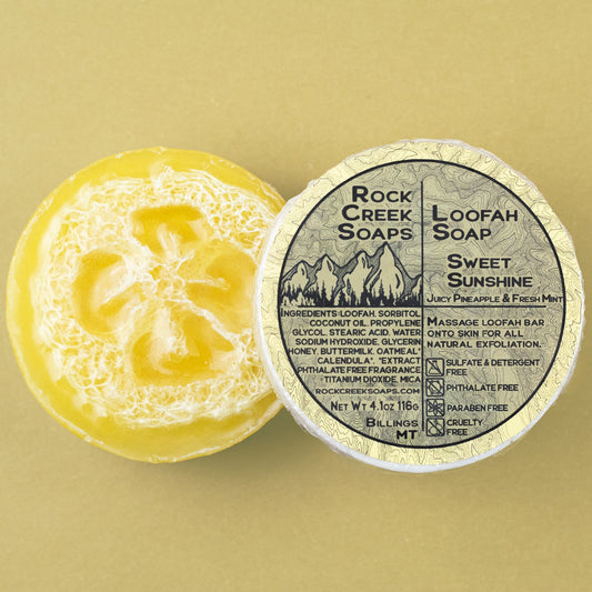 Sweet Sunshine loofah soap from Rock Creek Soaps with bright yellow and orange colors, showcasing a natural exfoliating soap bar.