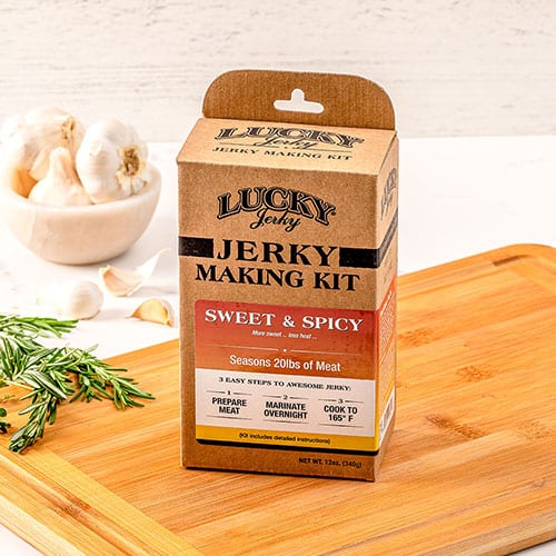 Sweet and spicy jerky making kit with seasoning packs and tools from Nebraska Star Beef for homemade beef jerky.