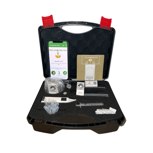 TeraGanix microBIOMETER soil testing kit with a clear view of the device and testing materials for soil microbial analysis