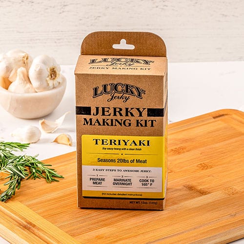 Teriyaki jerky making kit with Nebraska Star Beef, including seasoning and tools, for homemade jerky preparation.