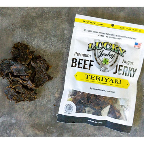 Sliced Teriyaki Beef Jerky from Nebraska Star Beef, 3 oz package, showing glossy, seasoned beef strips ready to eat.