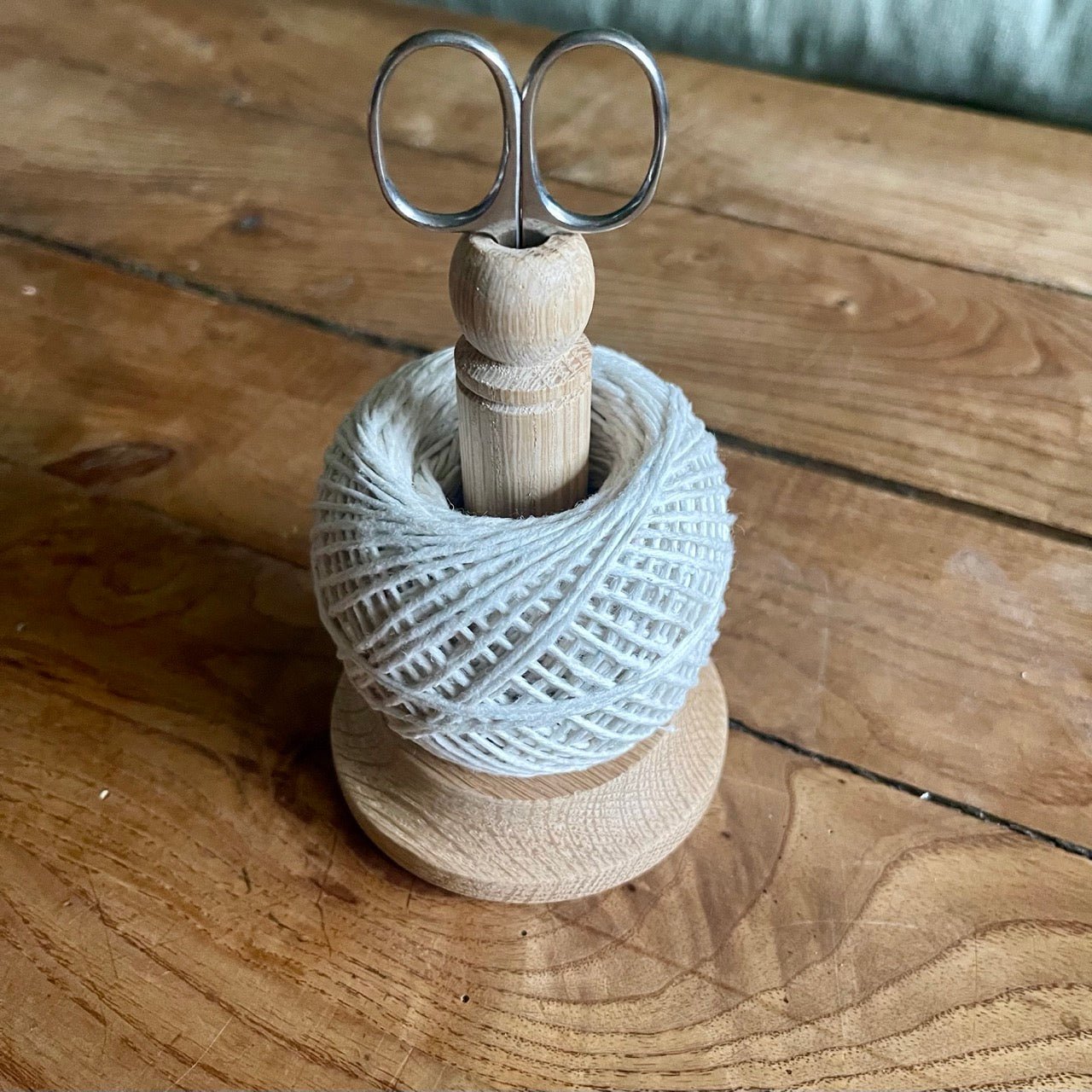 Oak String Tidy with scissors and baker's twine from The Celtic Farm, featuring a rustic wooden container for organizing twine and tools.