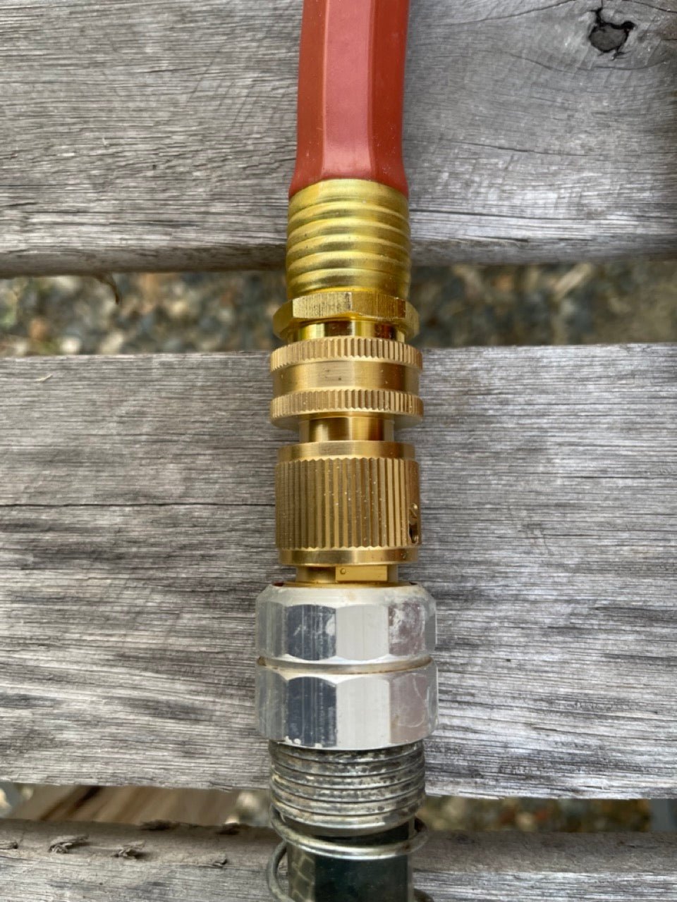 Brass hose connectors in a garden hose organization bundle by The Celtic Farm, perfect for organizing and connecting garden hoses.