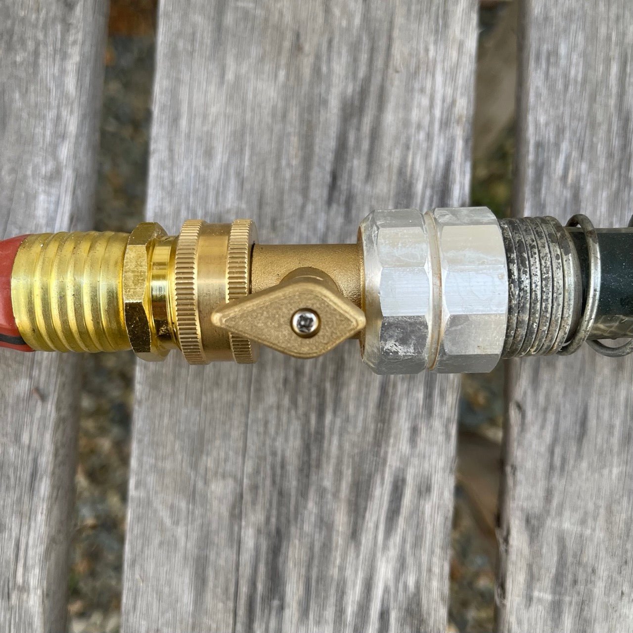 Brass hose connectors from The Celtic Farm, part of the garden hose organization bundle, used for connecting and organizing garden hoses.