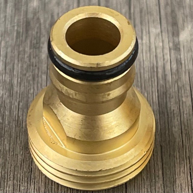 Brass quick connect garden hose connector by The Celtic Farm showing secure attachment and durable brass construction.