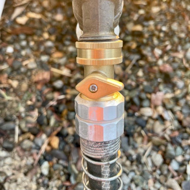 Brass shutoff valve for garden hoses with brass connectors, by The Celtic Farm, showing close-up of valve and fittings.