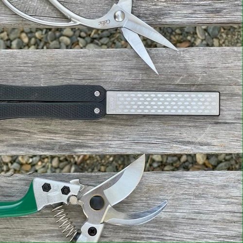 The Celtic Farm garden tool sharpener with diamond and carbon steel hone for sharpening pruners, clippers, mower blades, and scissors.