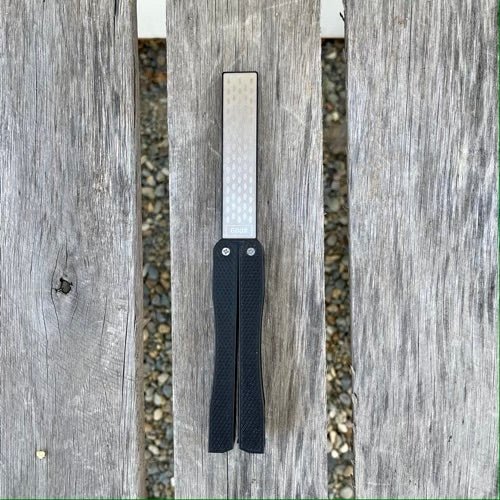 The Celtic Farm garden tool sharpener for clippers and scissors featuring a reversible diamond and carbon steel hone.