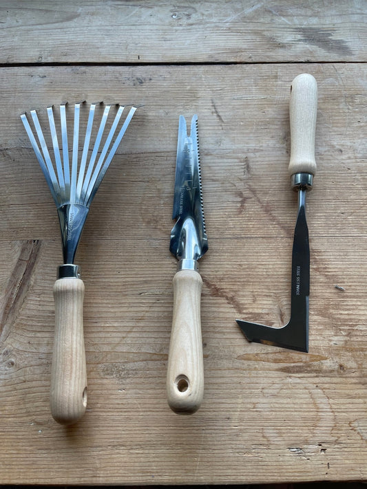 The Celtic Farm garden gift box with a burlap bag containing a unique garden tool set, perfect for gardening enthusiasts.