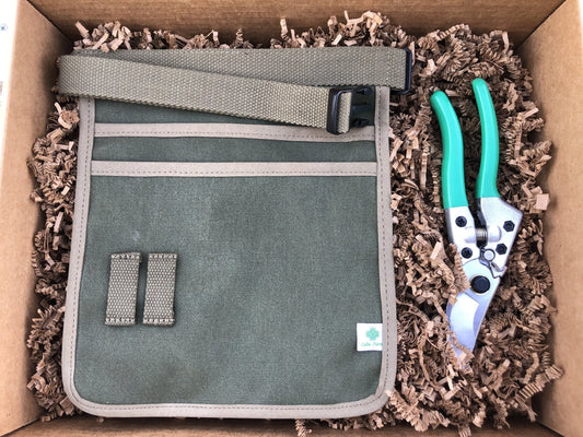 The Celtic Farm garden gift box with pruners, garden tool belt, and gardening tools for outdoor gardening and plant care.