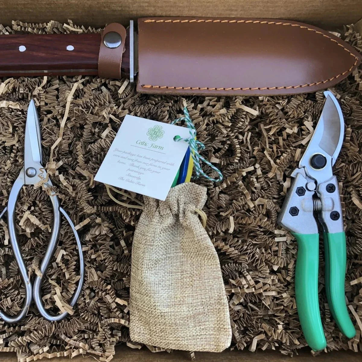 Ultimate Garden Gift Box by The Celtic Farm including Hori Hori, pruners, garden snips, and tool sharpeners in a complete tool kit.