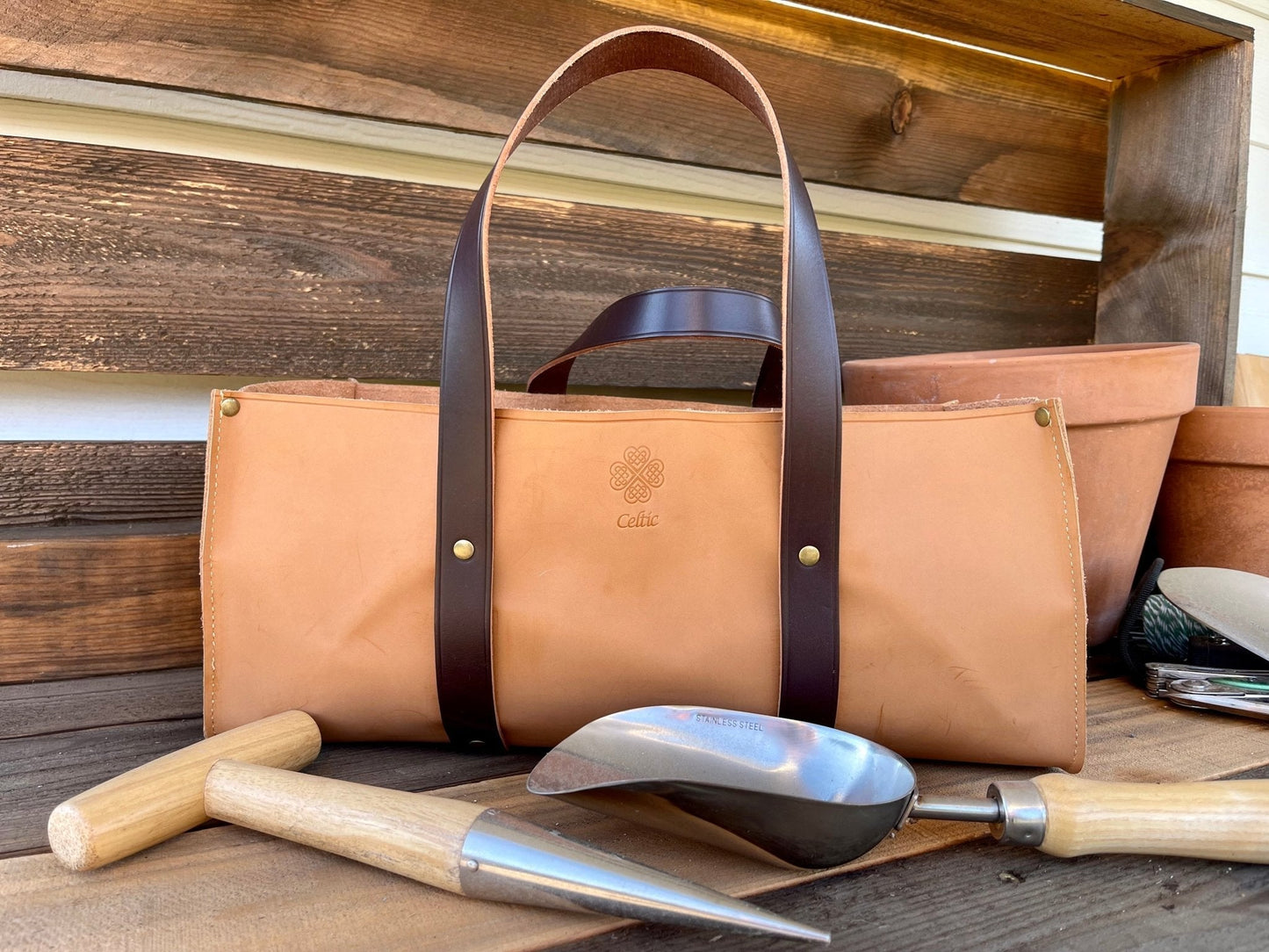 The Celtic Farm Garden Master Tool Set with five gardening tools in a burlap gift box, ideal for gardening enthusiasts.