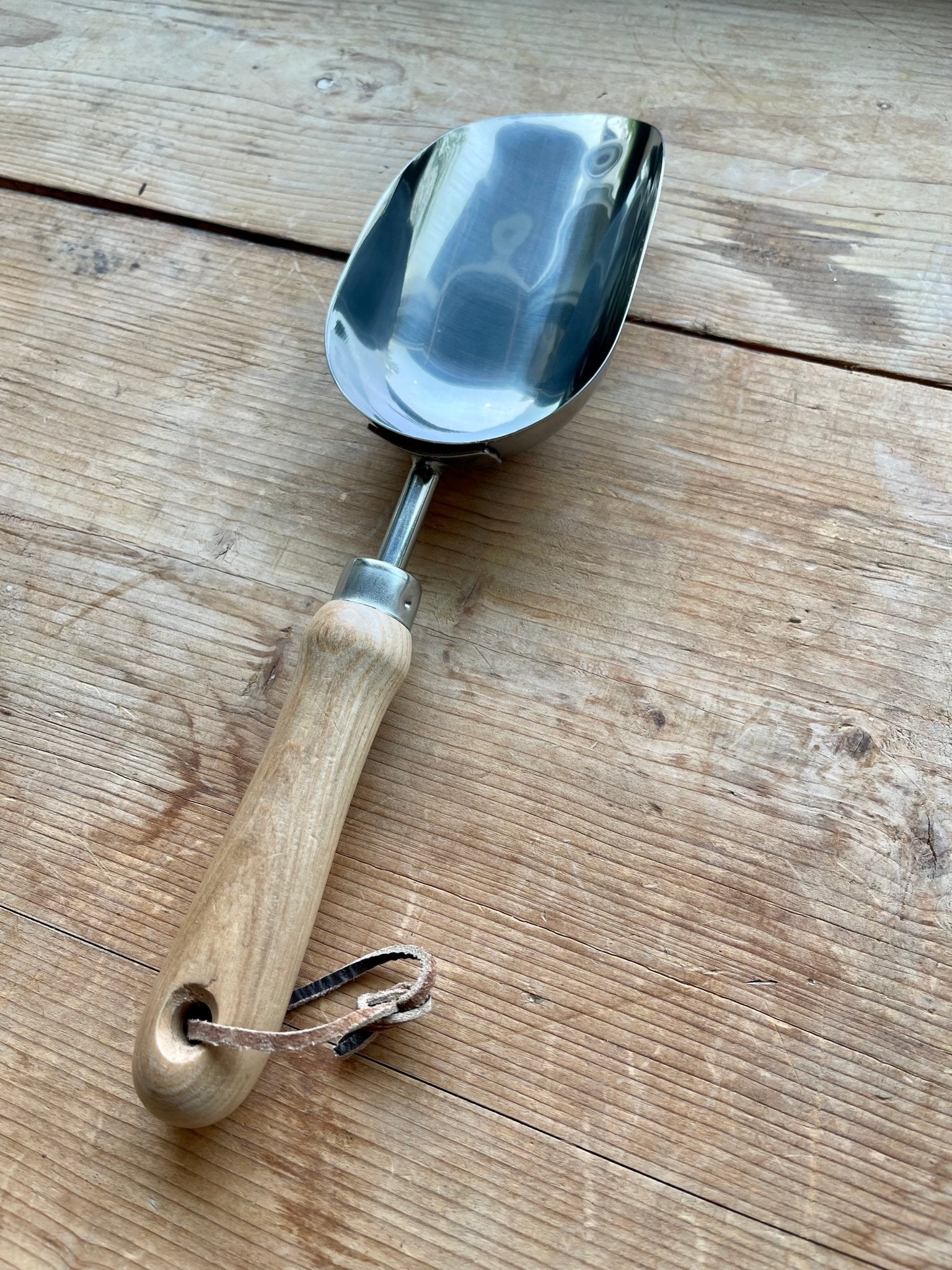 The Celtic Farm Potter's Tool Set includes three gardening tools inside a burlap gift box, ideal for potting and gardening.