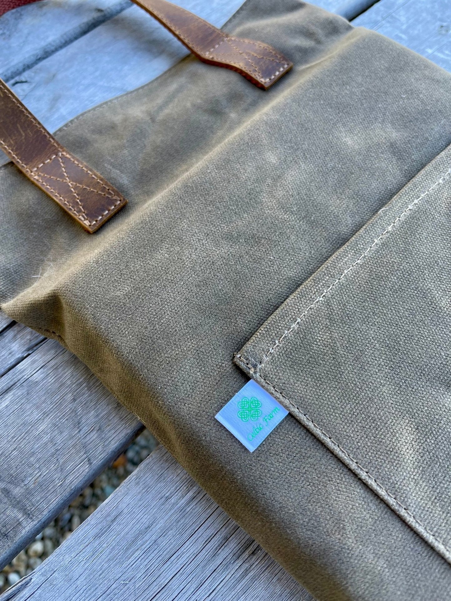 Waxed canvas garden kneeler pad by The Celtic Farm, providing comfortable support for gardening tasks and kneeling.
