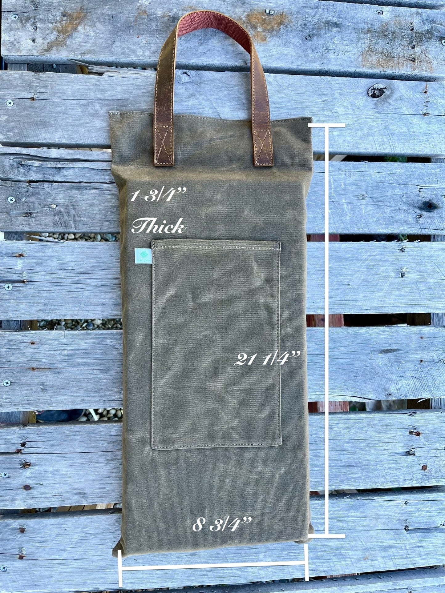Waxed canvas garden kneeler pad by The Celtic Farm, providing comfortable cushioning for gardening tasks.
