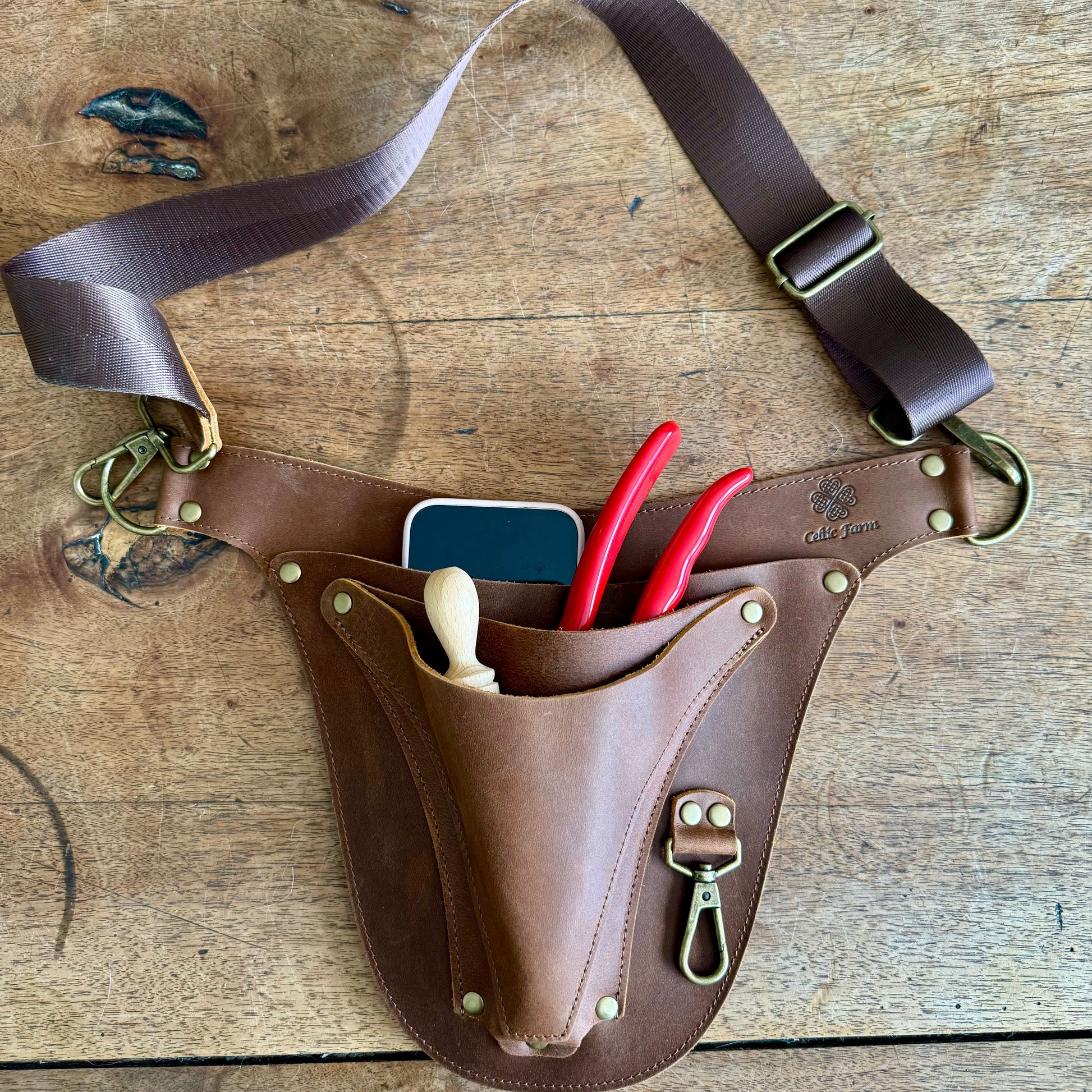 The Celtic Farm Ultimate Leather Garden Tool Belt with reinforced rivets, designed for master gardeners, showing multiple tool loops.
