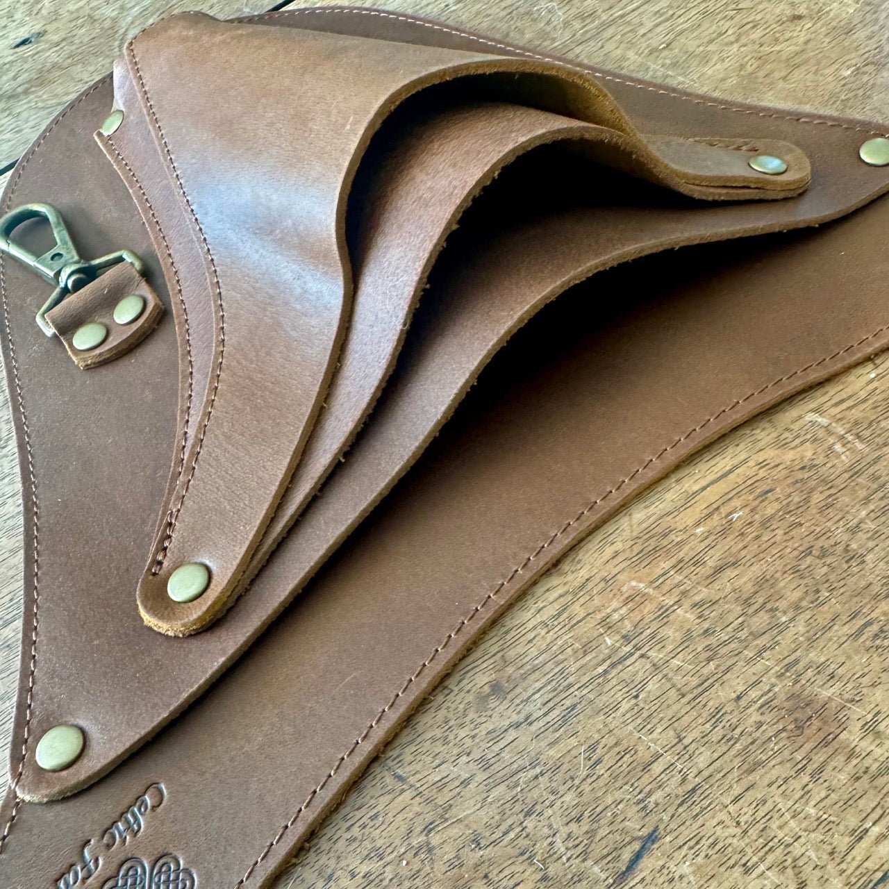 The Celtic Farm Ultimate Leather Garden Tool Belt with reinforced rivets, designed for gardeners, shown with multiple tool holders.