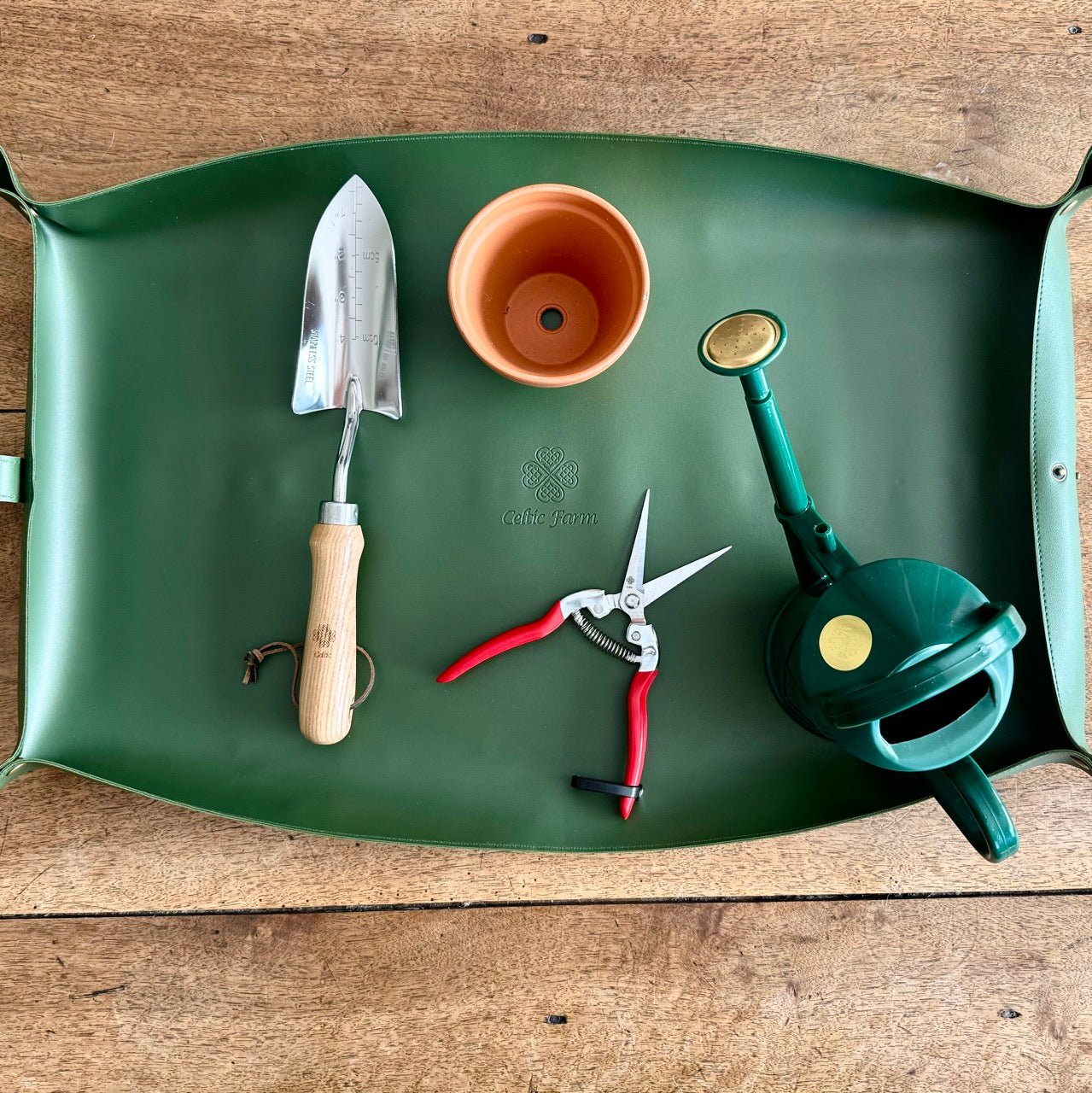 Waterproof potting mat from The Celtic Farm, ideal for tidy gardening and protecting surfaces during planting and repotting.