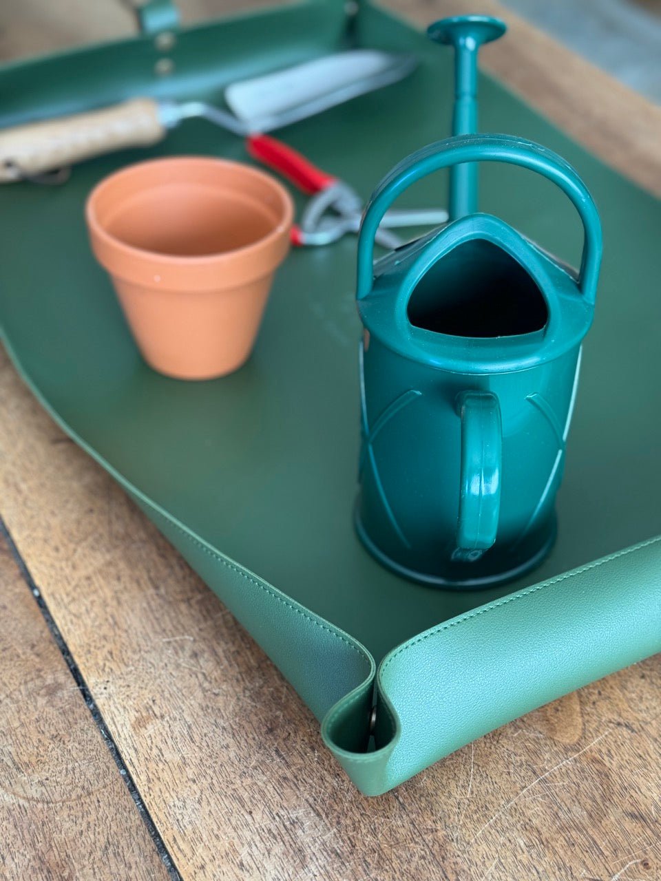 Waterproof potting mat from The Celtic Farm, ideal for tidy gardening and protecting surfaces during planting activities.