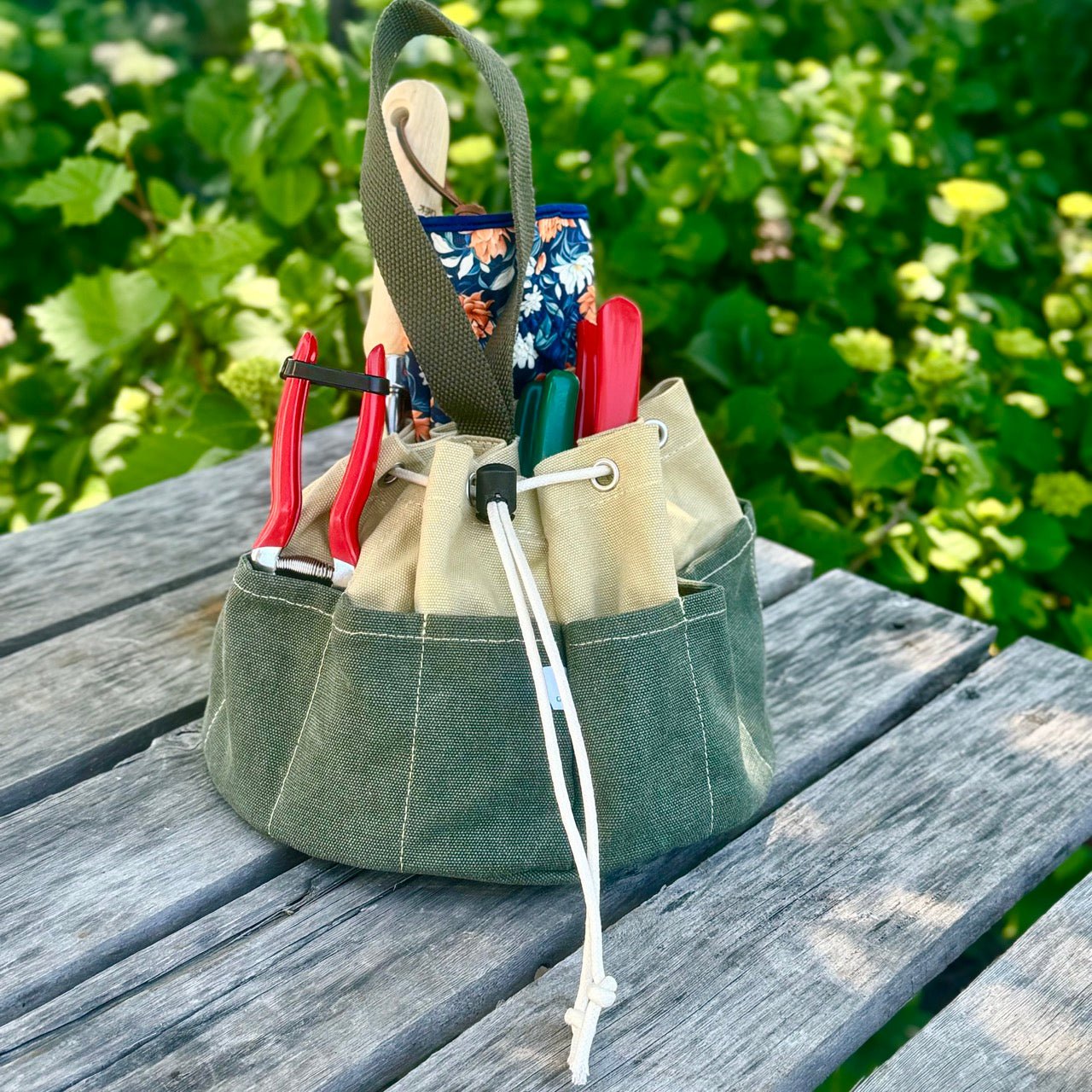 Heavy waxed canvas gardening tote bag from The Celtic Farm, durable garden bucket bag with sturdy handles for outdoor use.