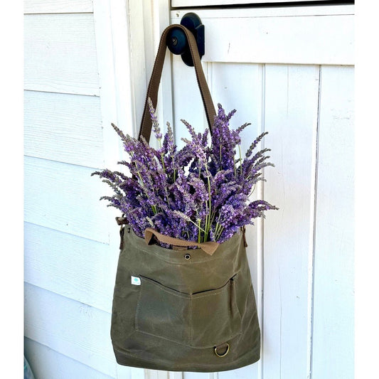 The Celtic Farm gardener's multipurpose shoulder bag with multiple compartments for tools, market items, or harvest.
