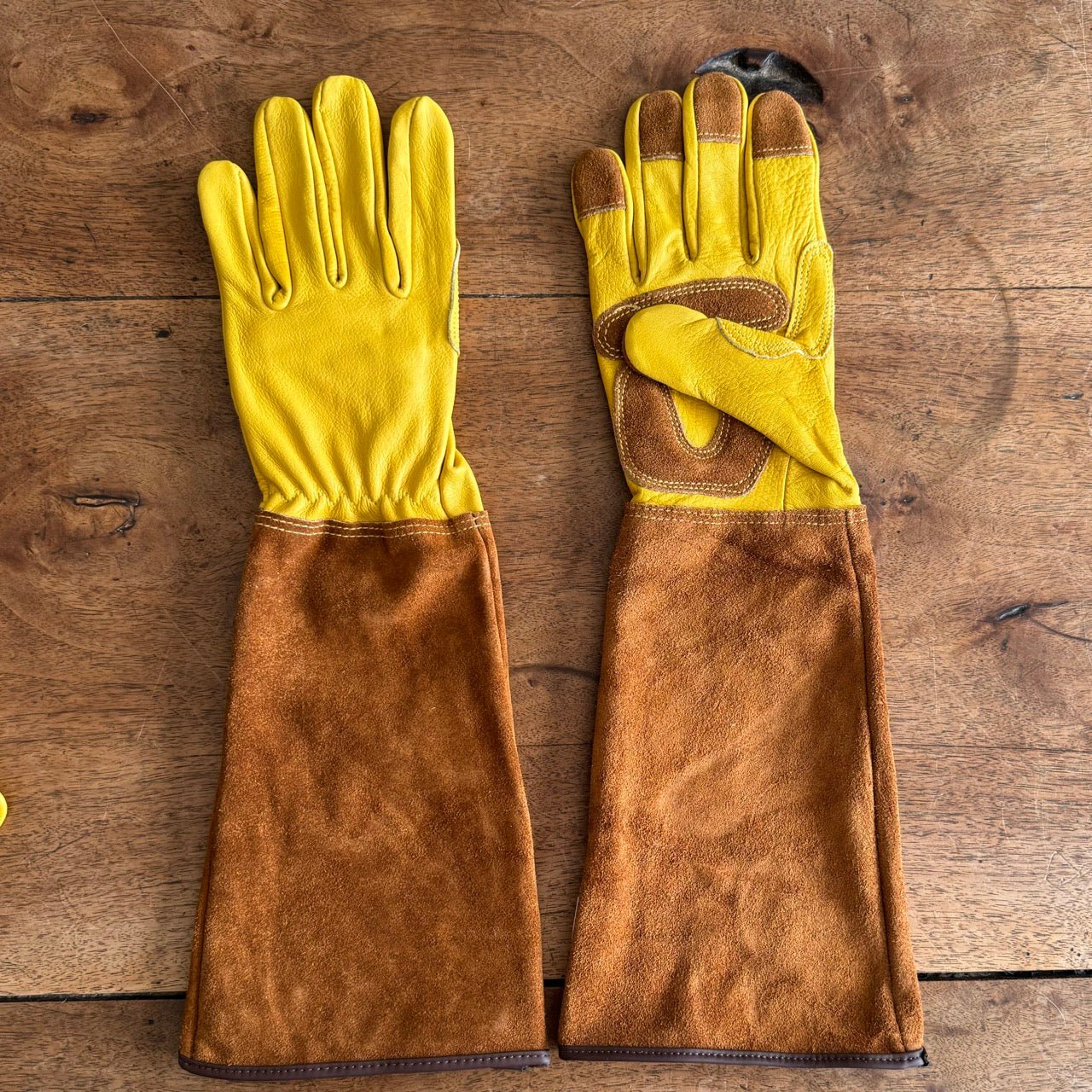 Long garden gloves for rose pruning, soft cowhide protection, by The Celtic Farm, shown in durable, flexible gardening glove style.