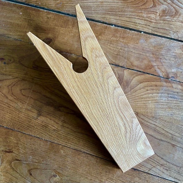 White oak English boot jack by The Celtic Farm, a sturdy home shoe aid for removing boots easily and comfortably.