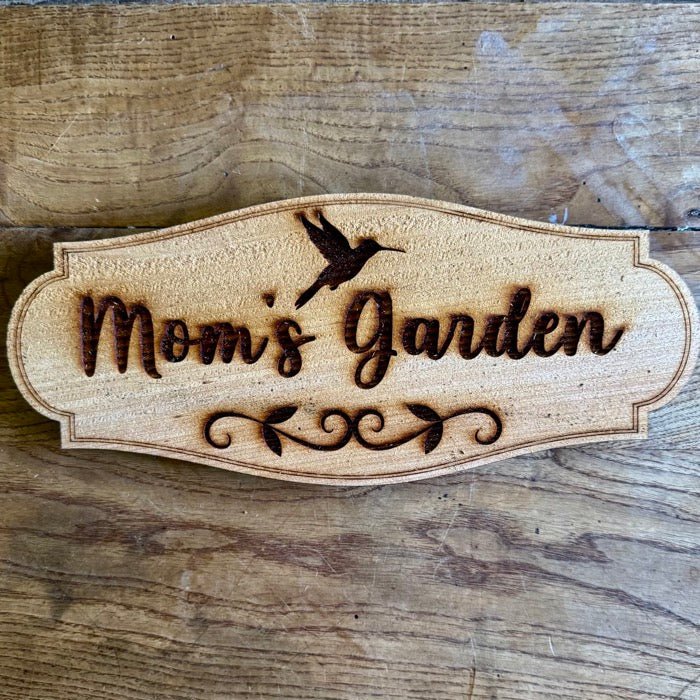 Mom's Garden Sign with Hummingbird from The Celtic Farm, made in USA with durable American cedar, featuring decorative hummingbird artwork.