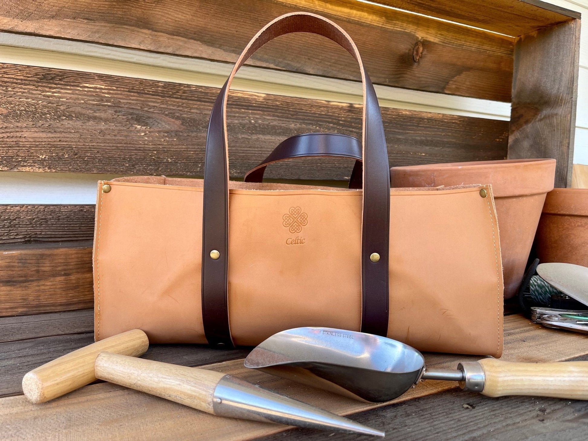Leather gardener's tool bag by The Celtic Farm, durable leather tool bag with multiple compartments for gardening tools.