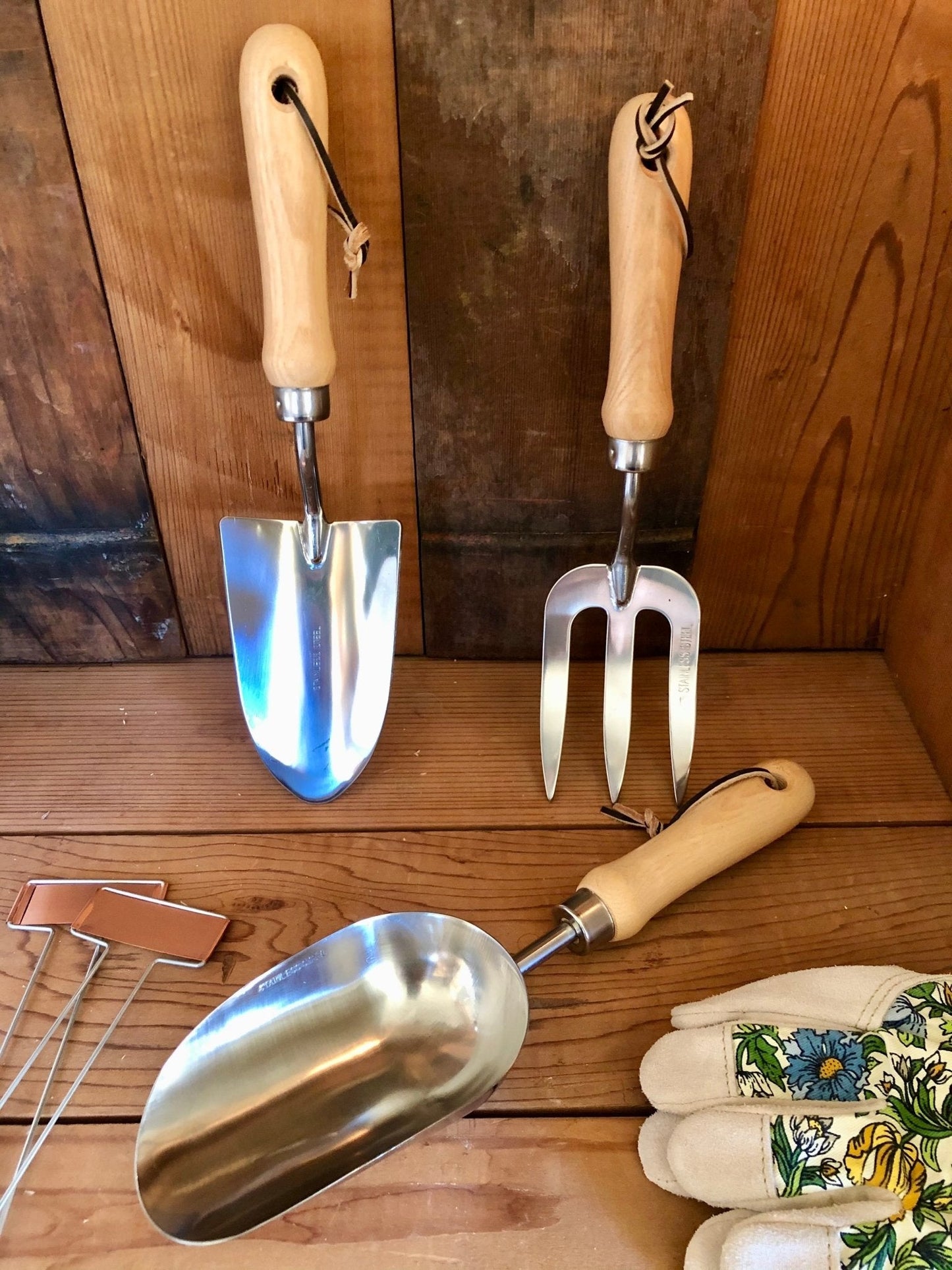 Garden hand tool set by The Celtic Farm featuring hardwood handles and stainless steel tools in a burlap bag.