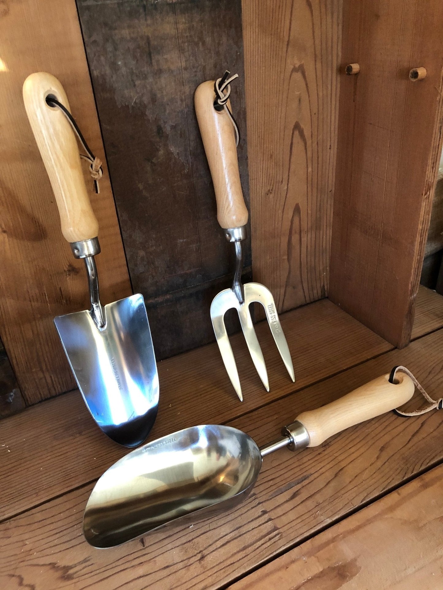 Garden hand tool set by The Celtic Farm with hardwood handles and stainless steel tools in a burlap storage bag.