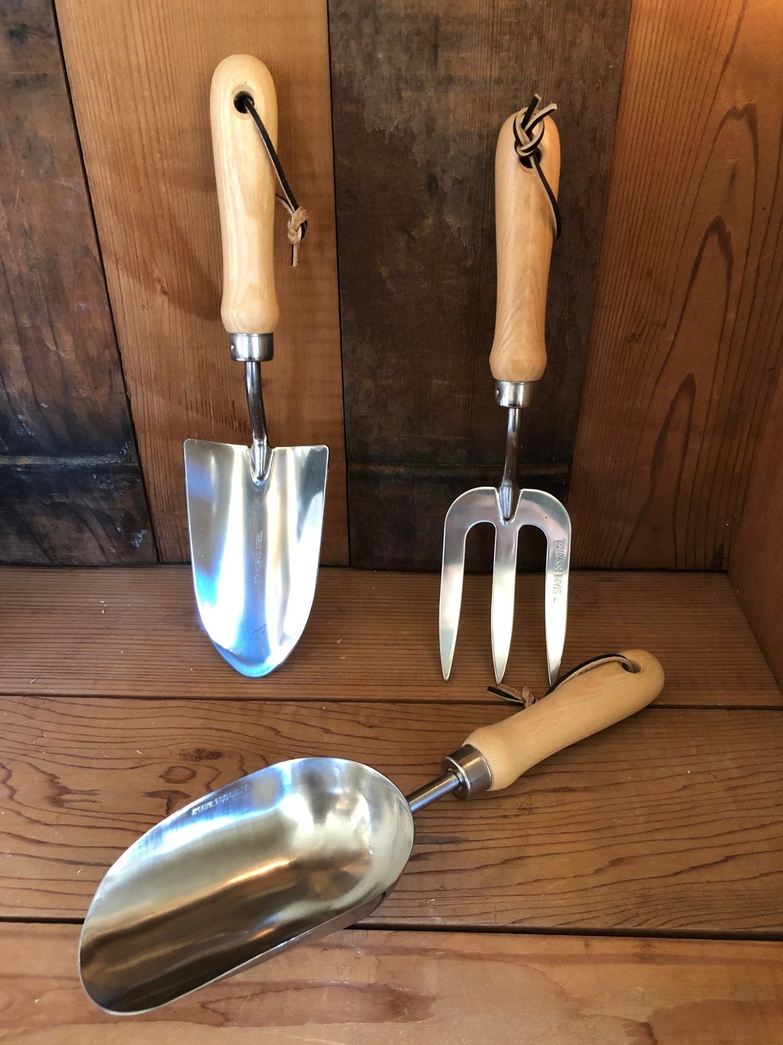 Garden hand tool set from The Celtic Farm with hardwood handles and stainless steel tools in a burlap bag.