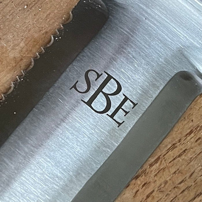 The Celtic Farm Hori Hori garden tool in a gift box, featuring a versatile gardening knife with a wooden handle and sheath.