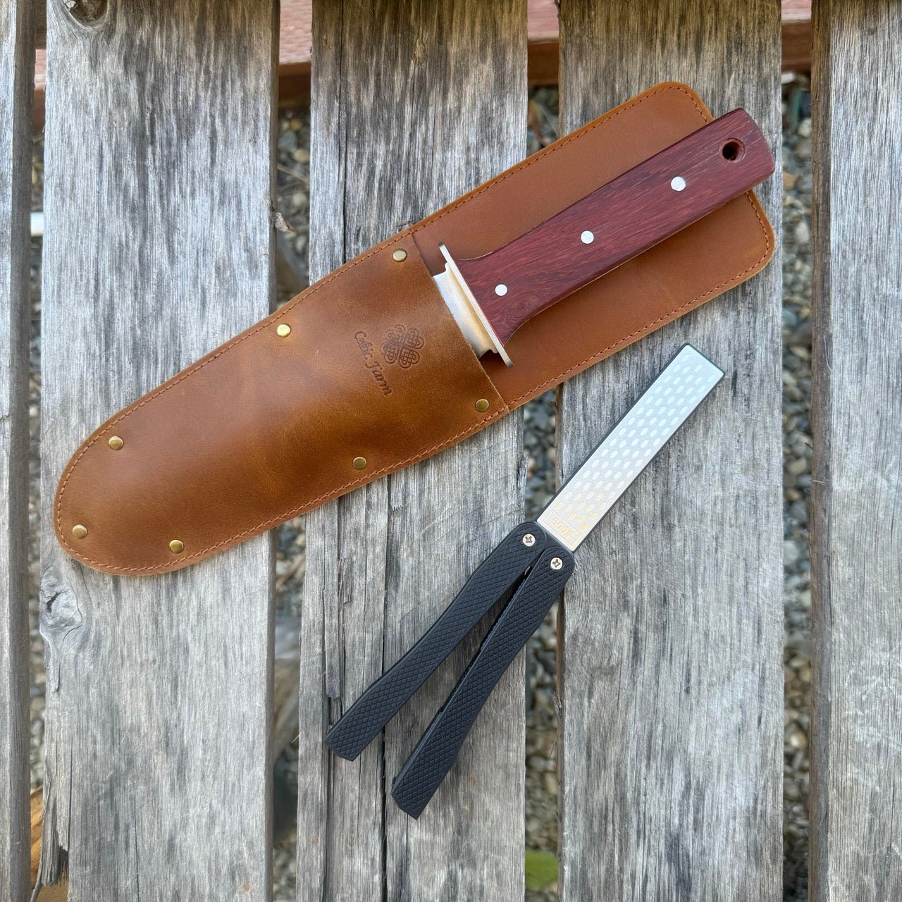 The Celtic Farm Hori Hori garden tool in a gift box, featuring a versatile gardening knife with a wooden handle and protective sheath.