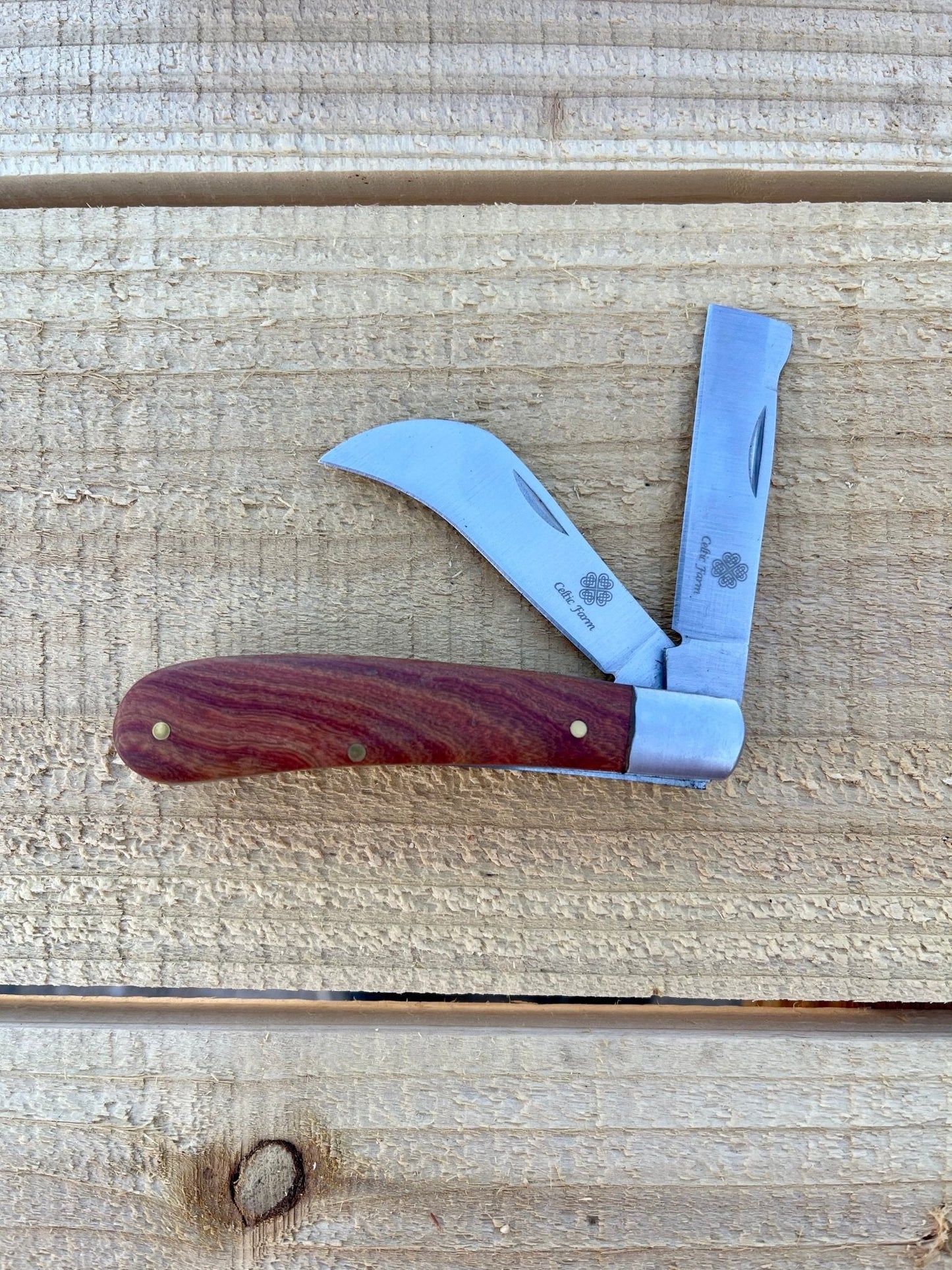 Professional gardener's knife by The Celtic Farm, ideal for pruning, grafting, and propagation; shows the sharp blade and handle.