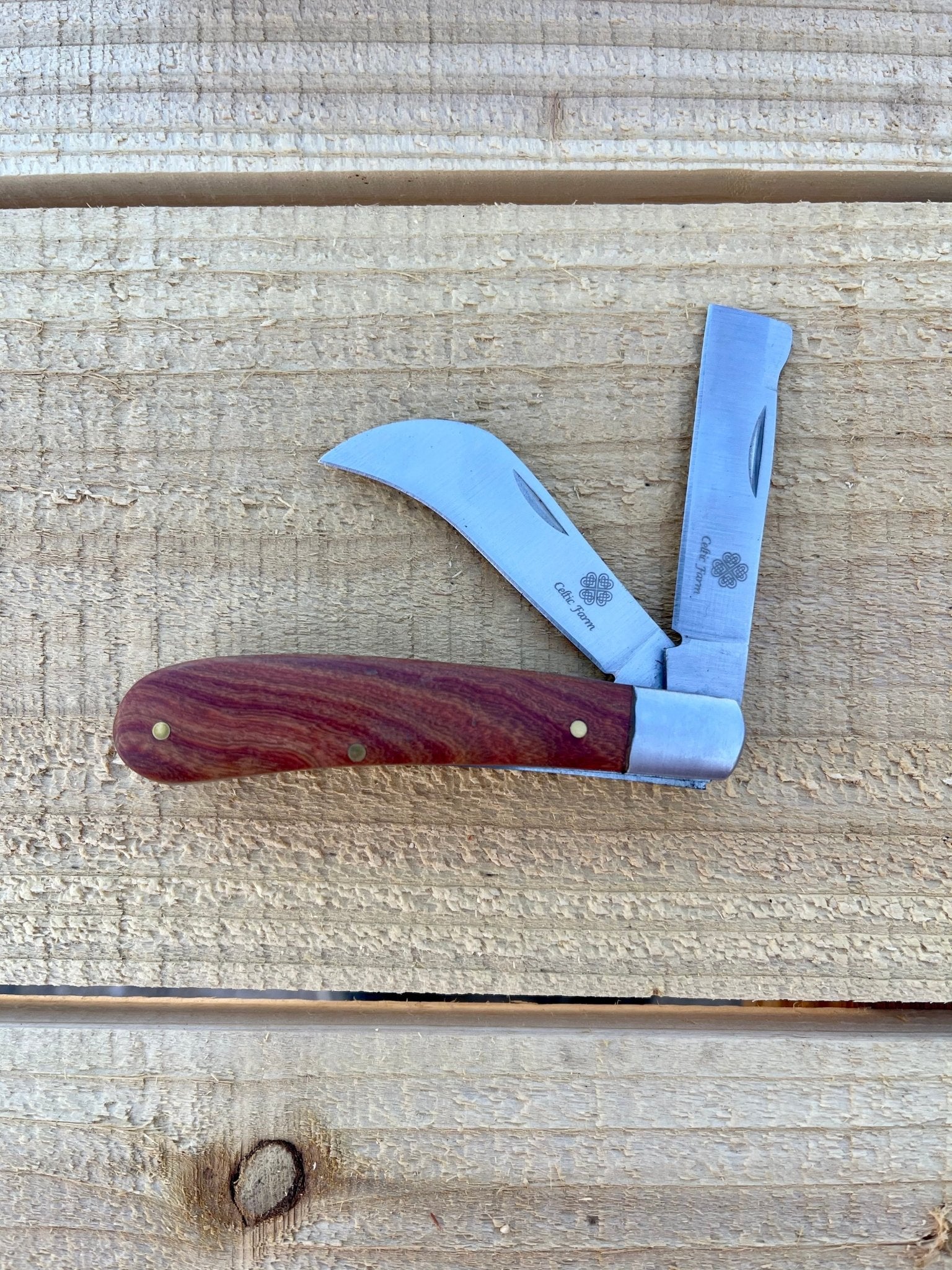 Professional gardener's knife by The Celtic Farm, ideal for pruning, grafting, and propagation; shows the sharp blade and handle.