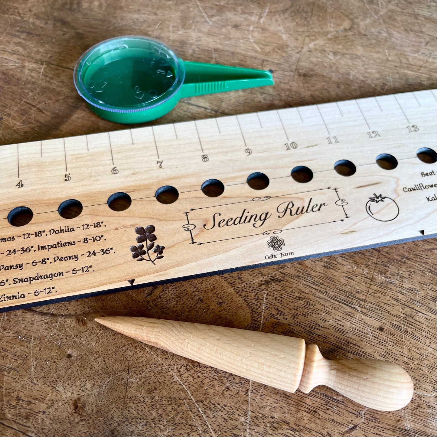 Celtic Farm seeding gift set with dibble, seeder, and ruler, garden tools for planting and soil measurement.